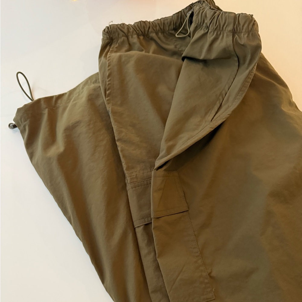 Victoria's Secret pink parachute pants in olive green.